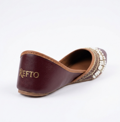 Close up of REFTO maroon khussa showing pearl embroidery and detailed craftsmanship