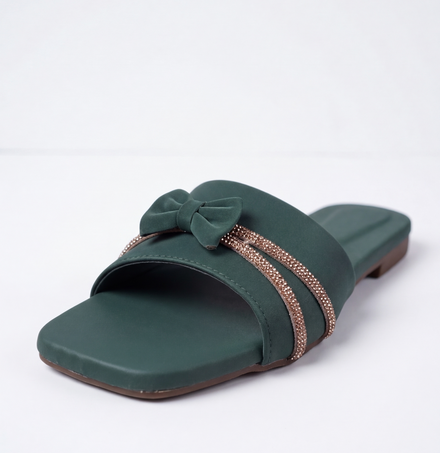Stylish dark green flat sandal with decorative bow and shiny stones
