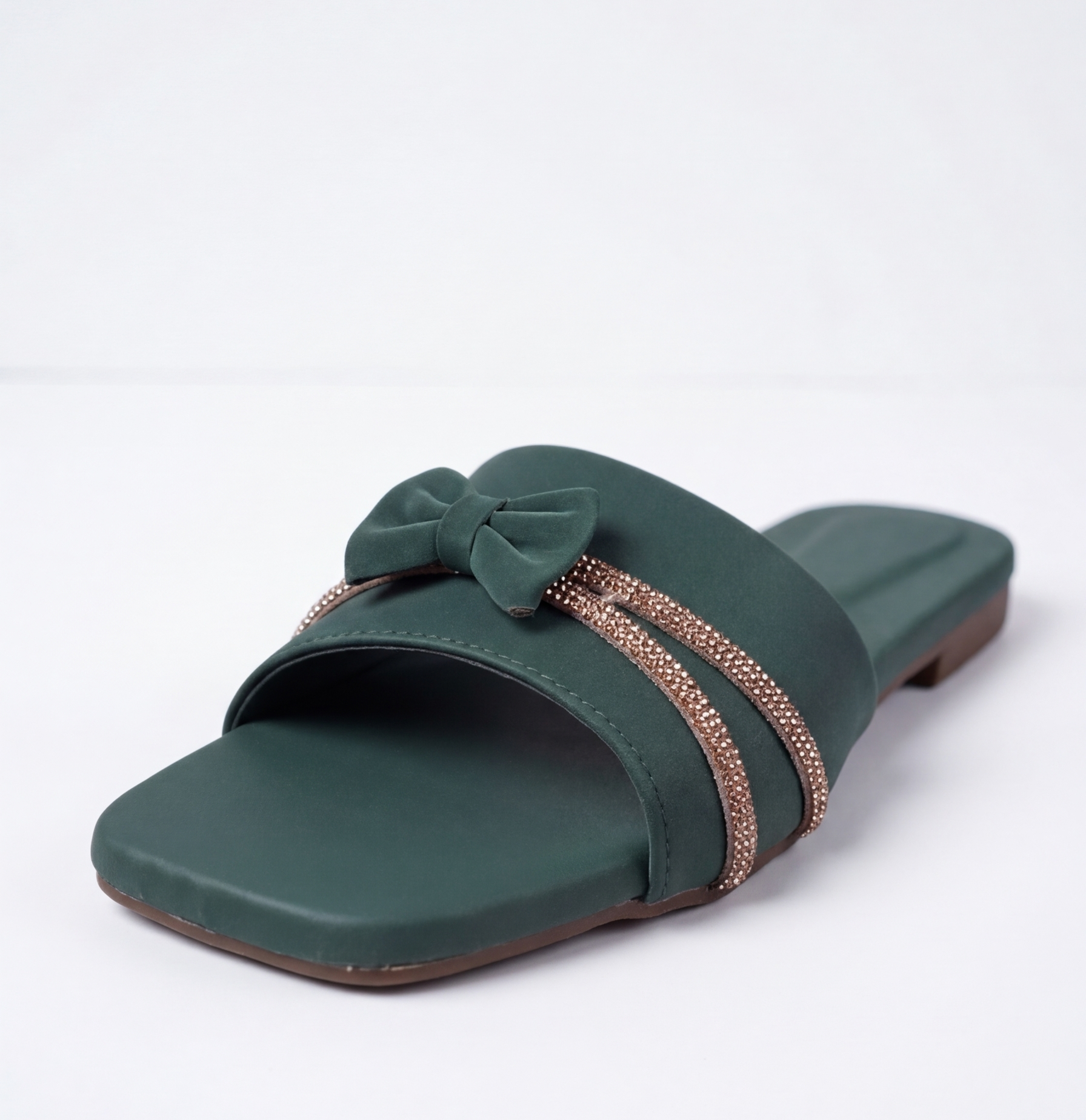Stylish dark green flat sandal with decorative bow and shiny stones